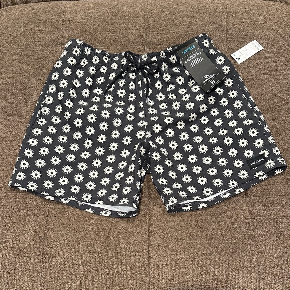 Rip Curl Black Board Shorts with White Sunburst Design